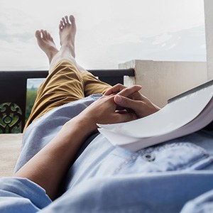 Palm Coast patient relaxing after dental implant surgery