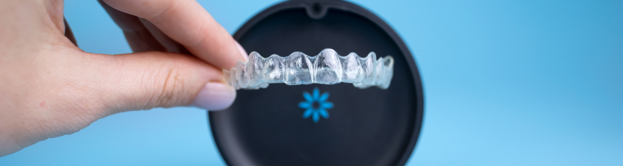 Taking Invisalign clear aligner in Palm Coast out of case