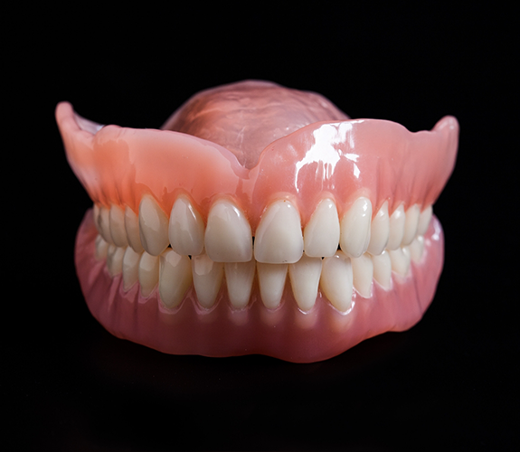 Full dentures on a black background